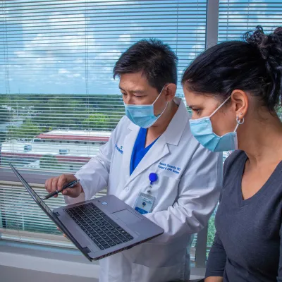 Dr. Iswanto Sucandy with a patient.