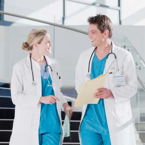 Male and female doctors chatting