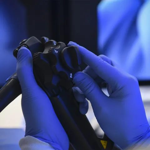 A surgeon's hands holding Endoscopy Equipment