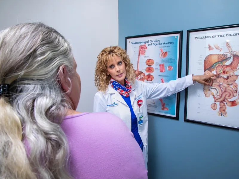 Dr. Sharona Ross explaining digestive track diagram to a patient