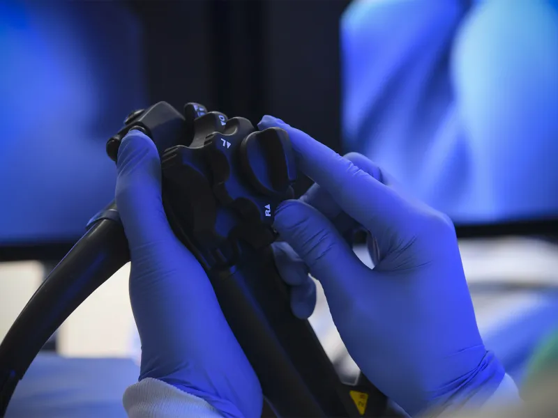 A surgeon's hands holding Endoscopy Equipment